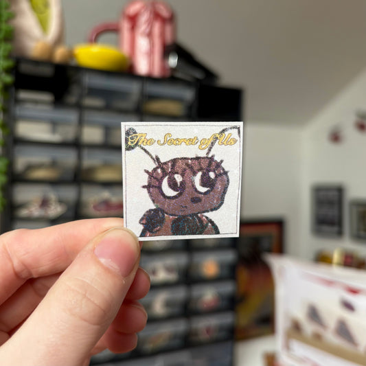 ‘the secret of us’ sticker